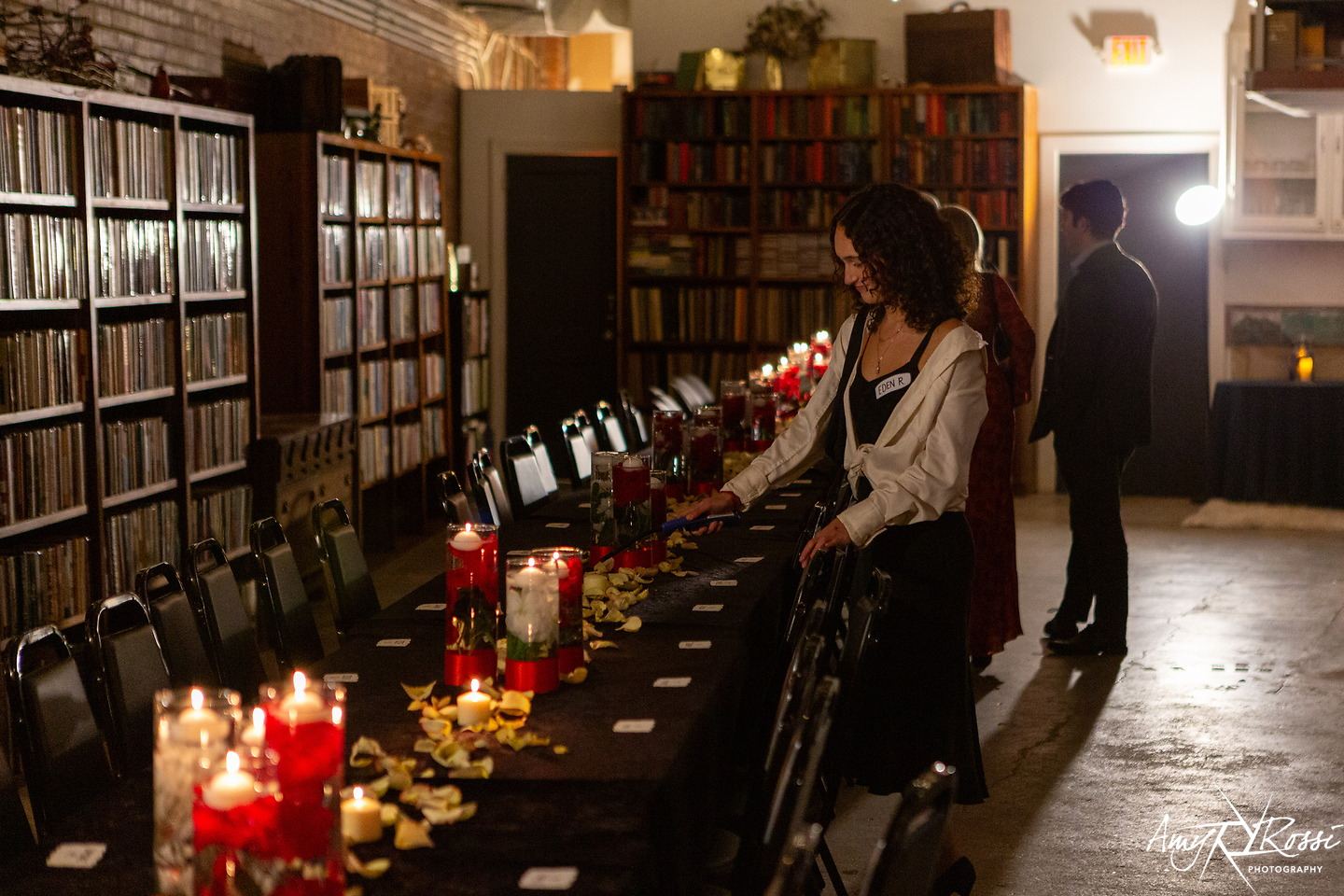 The formal table set with candles, seen from the head of the table