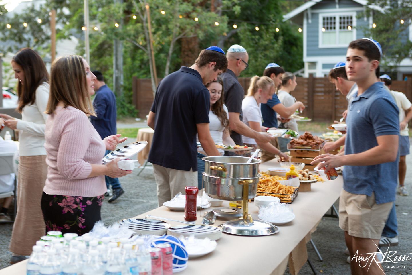 Students moving through the Shabbat dinner buffet line