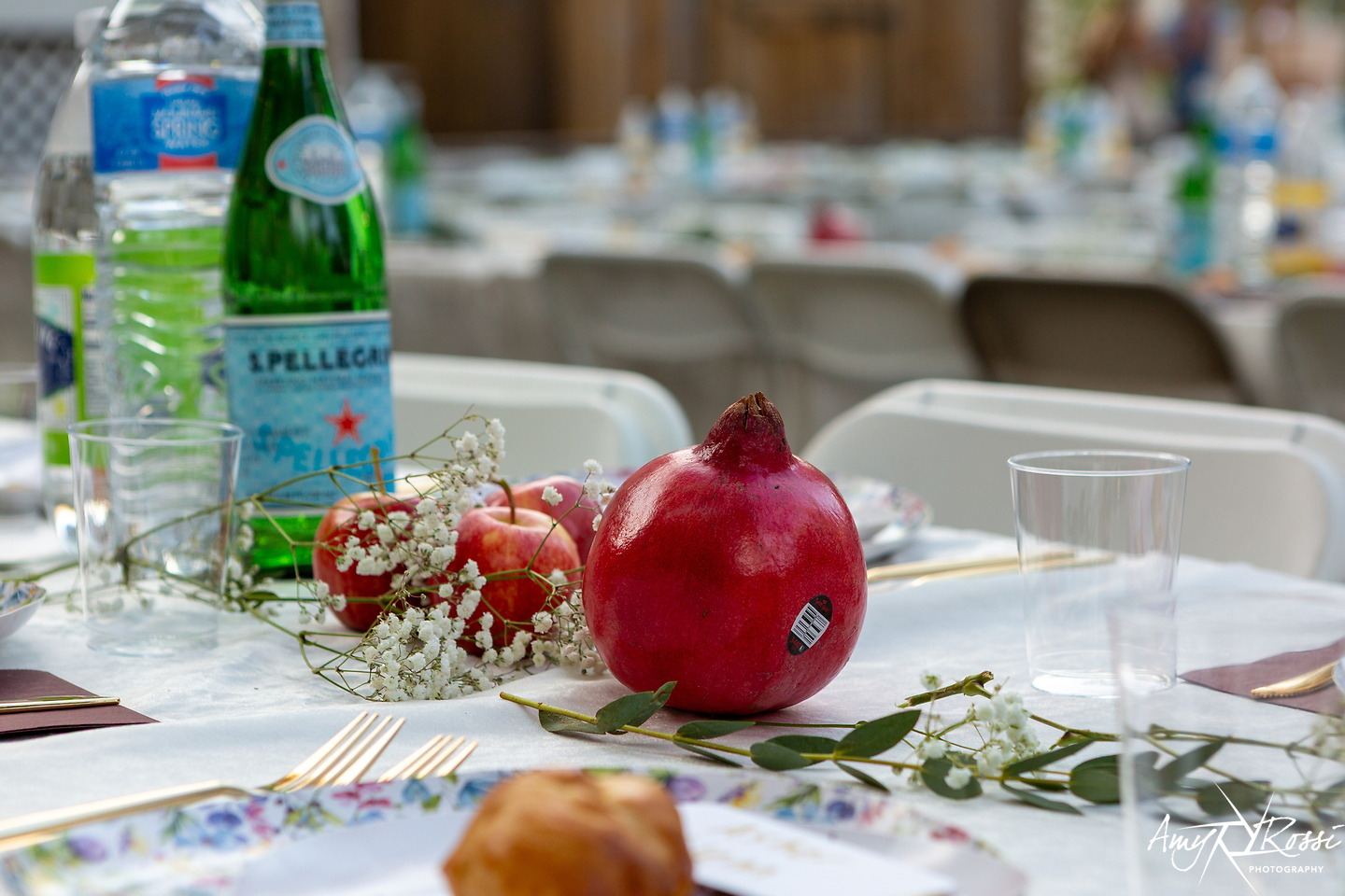 Pomegranates and honey set on a holiday table