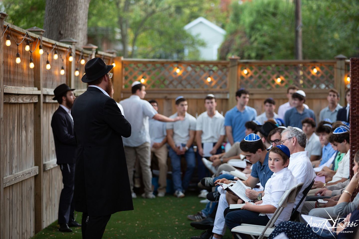 Students seated in the backyard for the Rosh Hashanah shofar service